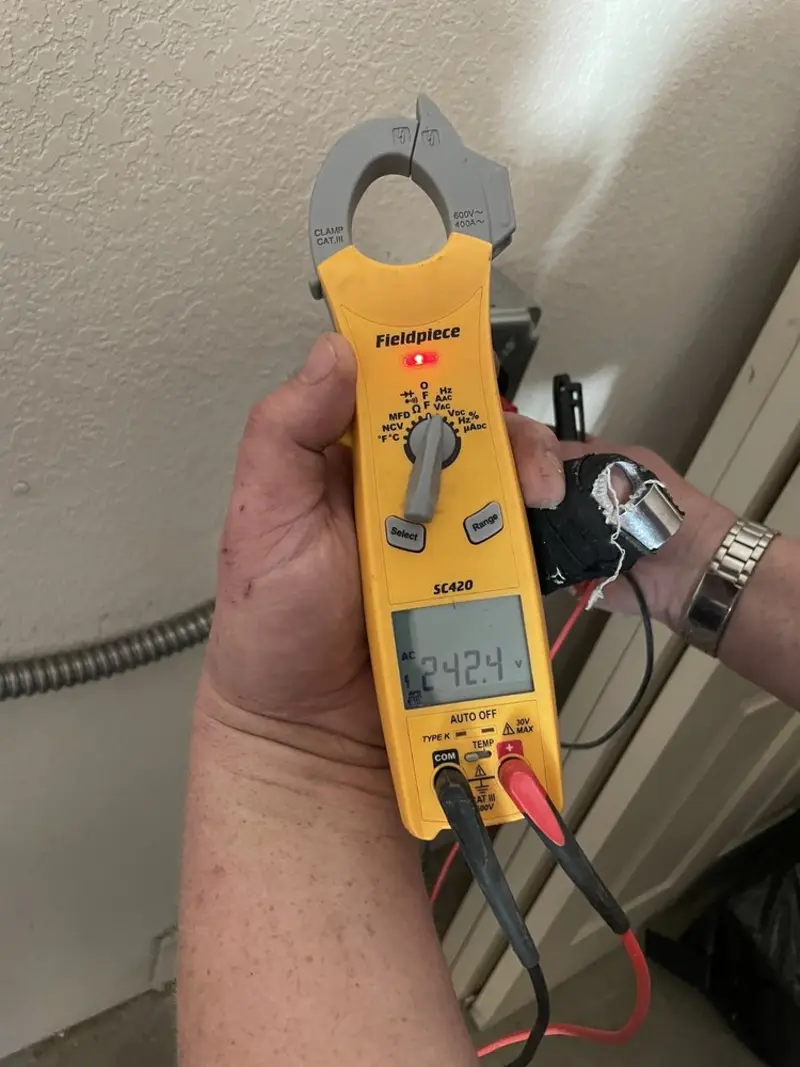 Voltage testing with clamp meter during Ceiling Fan Installation in Breese